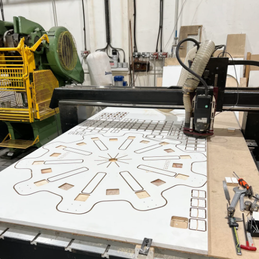 Which applications are best suited for CNC routers vs CNC mills?